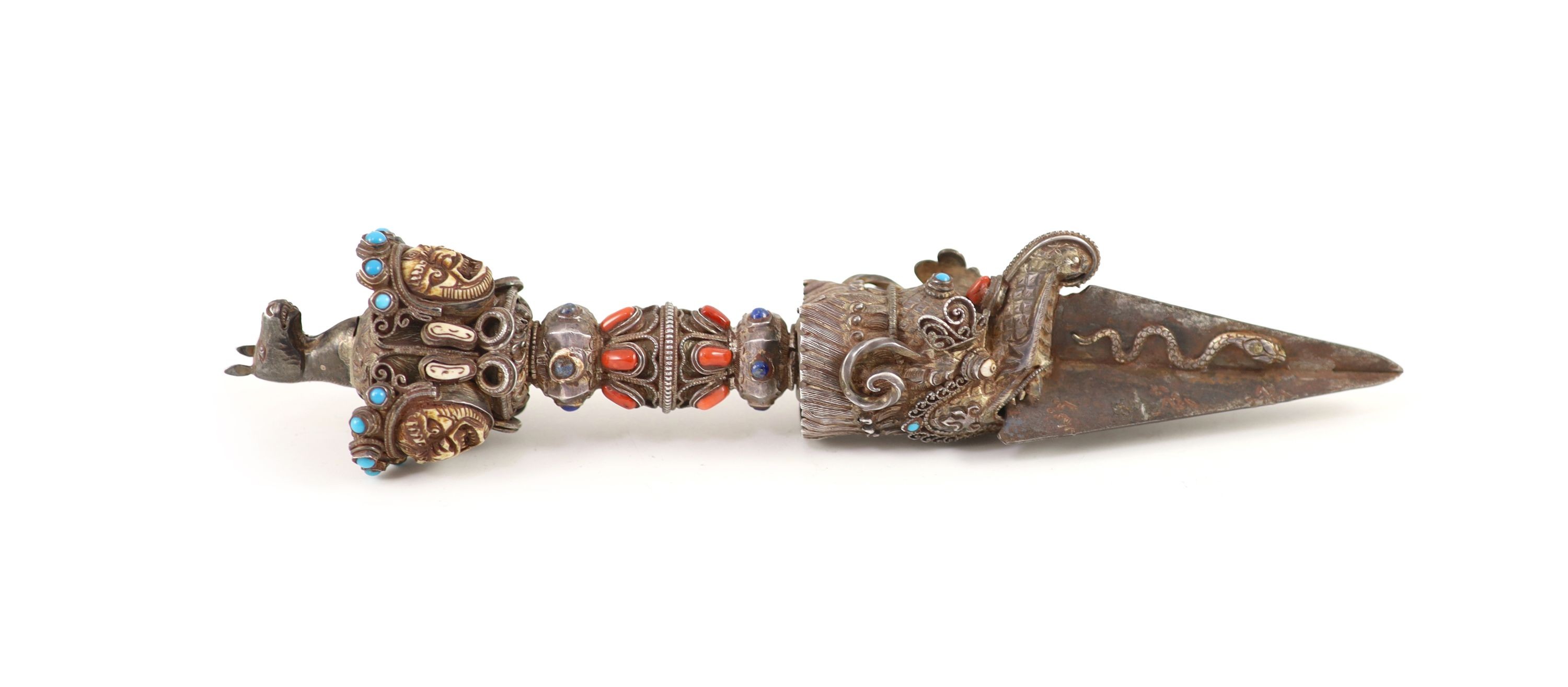 A Tibetan silver, bone and gem set phurbu (ritual dagger), 19th/20th century, 27.5 cm long, some of the stones replaced with glass